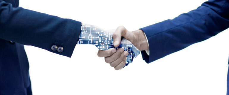 man-shaking-hand-with-robotic-arm Automation vs Digital Transformation