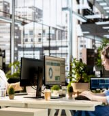 Female manager engaged in budget analysis and strategy development new Dubai office IT infrastructure setup guide 2026