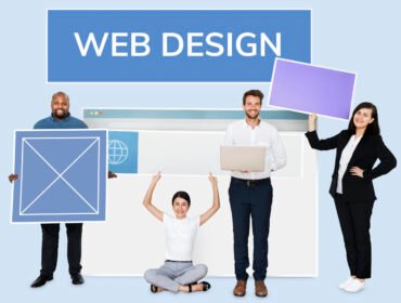 Happy diverse people holding a wed design board Web Design Trends Dubai 2026